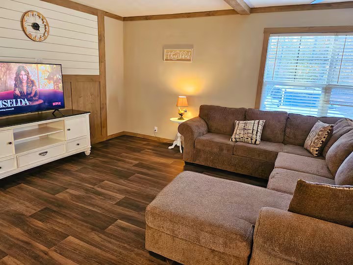 105 Saddle Surrey Road Coldspring, TX 77331 - Photo 13 of 48 a living room with furniture and a flat screen tv