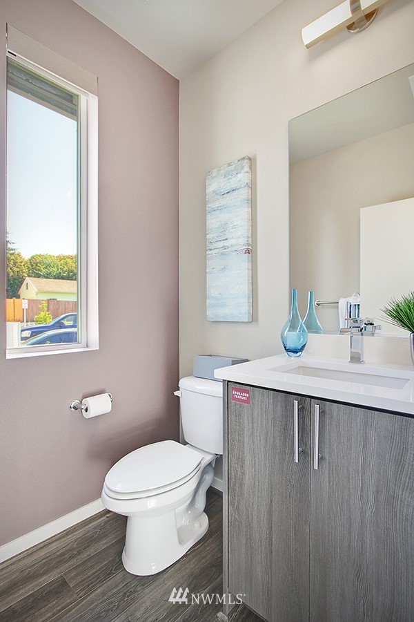 4423 232nd Place Southeast, Unit 19 Bothell, WA 98021 - Photo 12 of 23 a bathroom with a sink a toilet and mirror