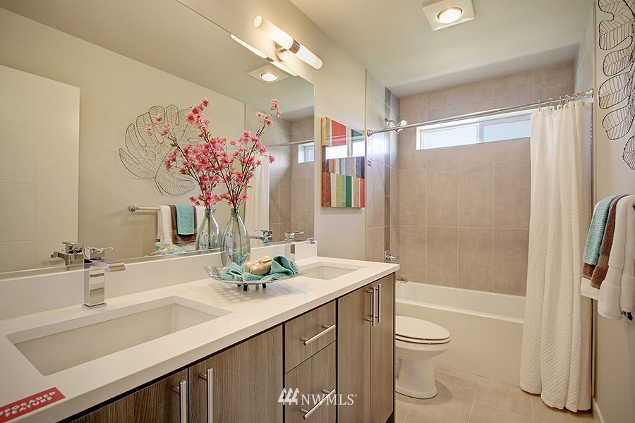 4423 232nd Place Southeast, Unit 19 Bothell, WA 98021 - Photo 18 of 23 a bathroom with a sink a toilet and shower