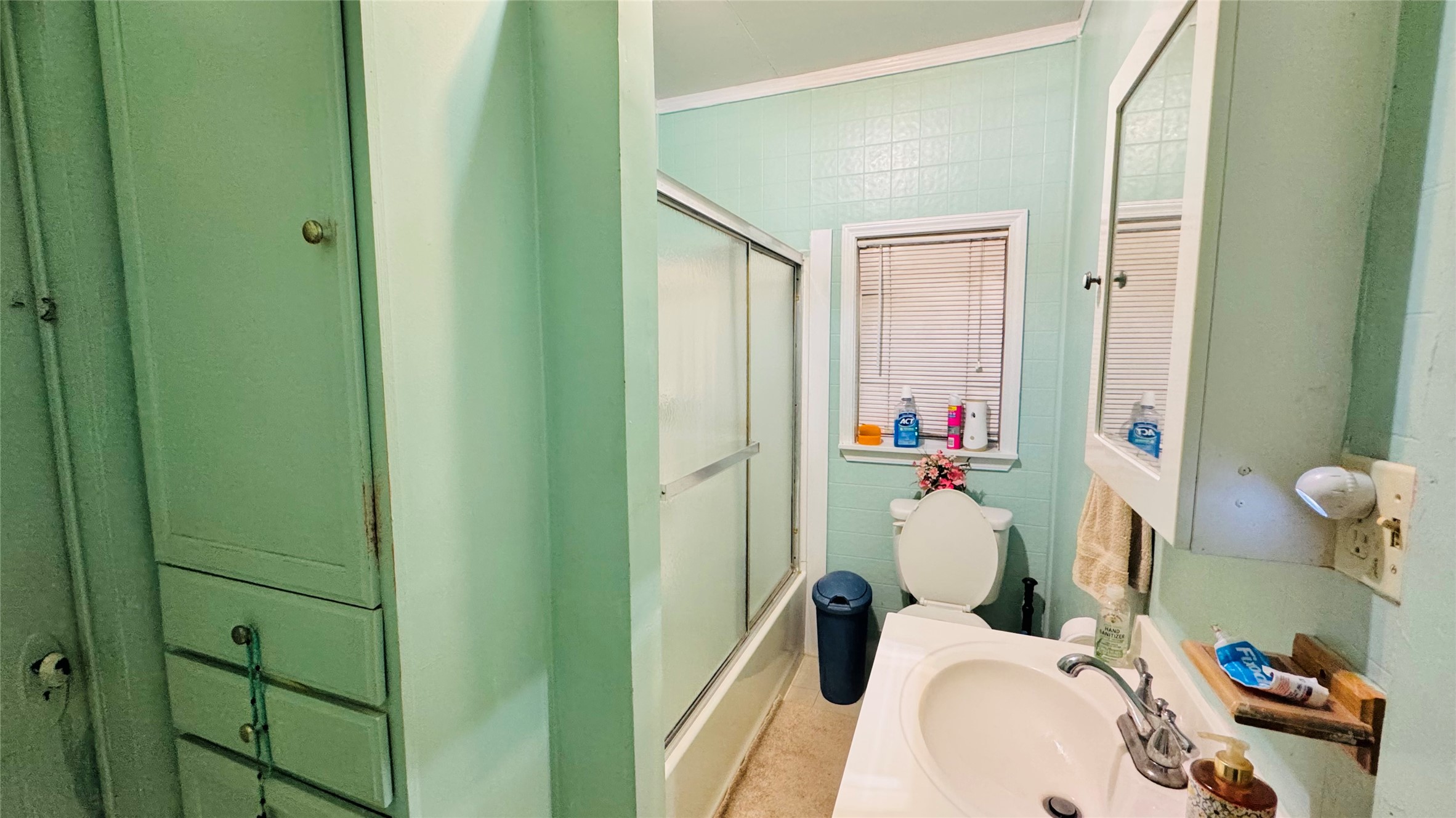 1604 Pine Street Georgetown, TX 78626 - Photo 7 of 13 a bathroom with a sink and a mirror