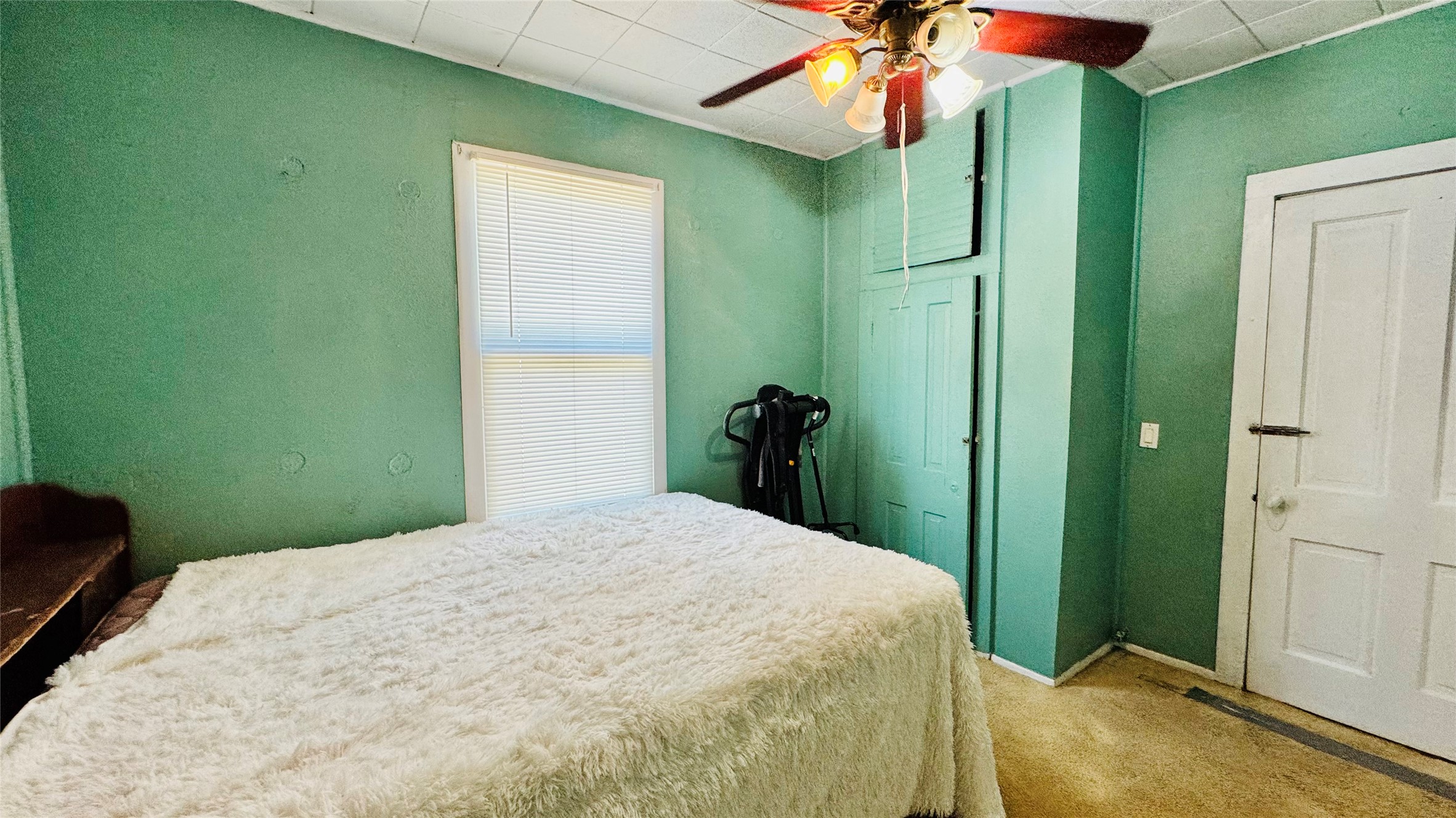 1604 Pine Street Georgetown, TX 78626 - Photo 9 of 13 a bedroom with a bed and chandelier