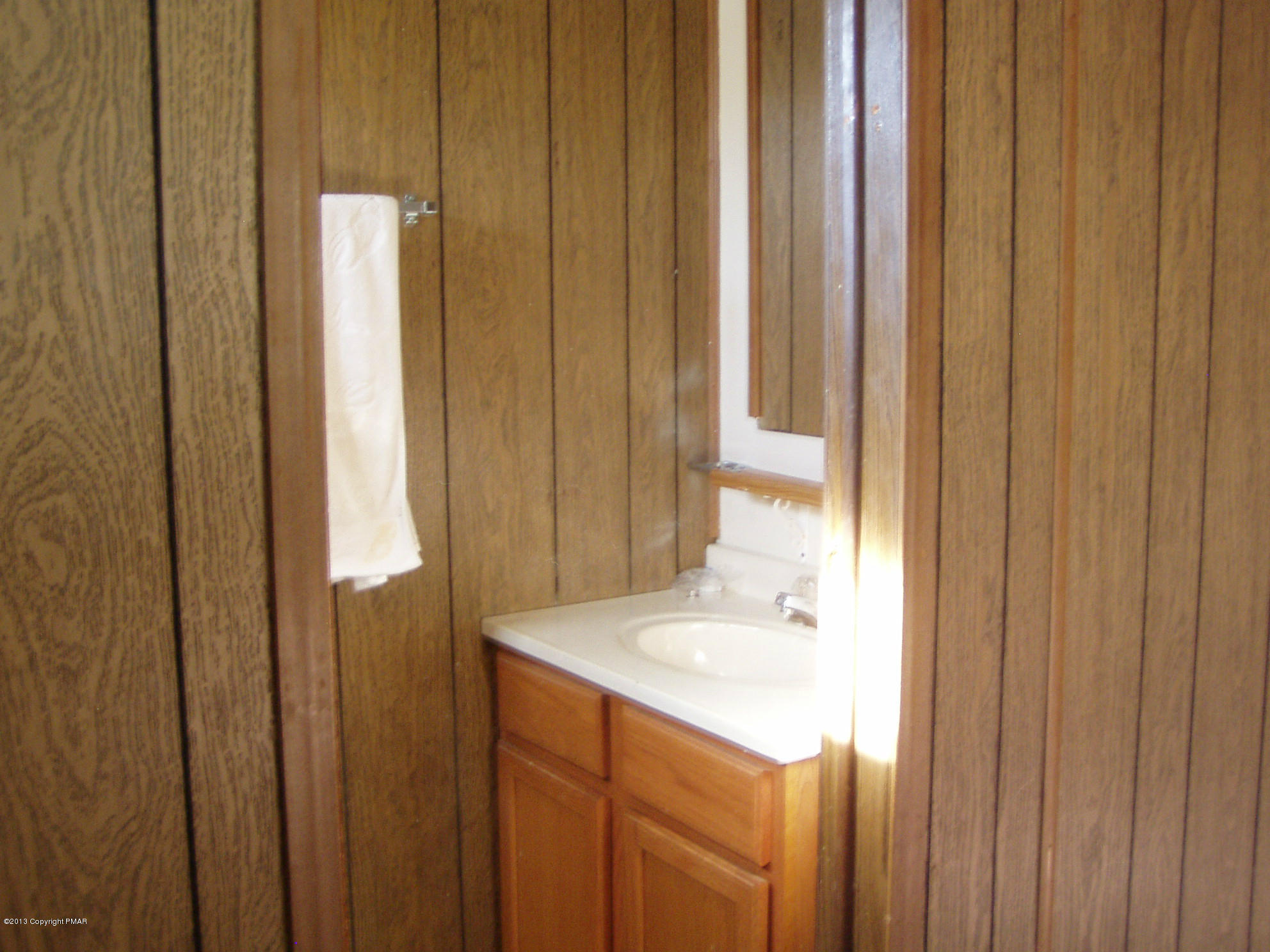 340 Summit Road Swiftwater, PA 18370 - Photo 12 of 16 a bathroom with a sink and a mirror