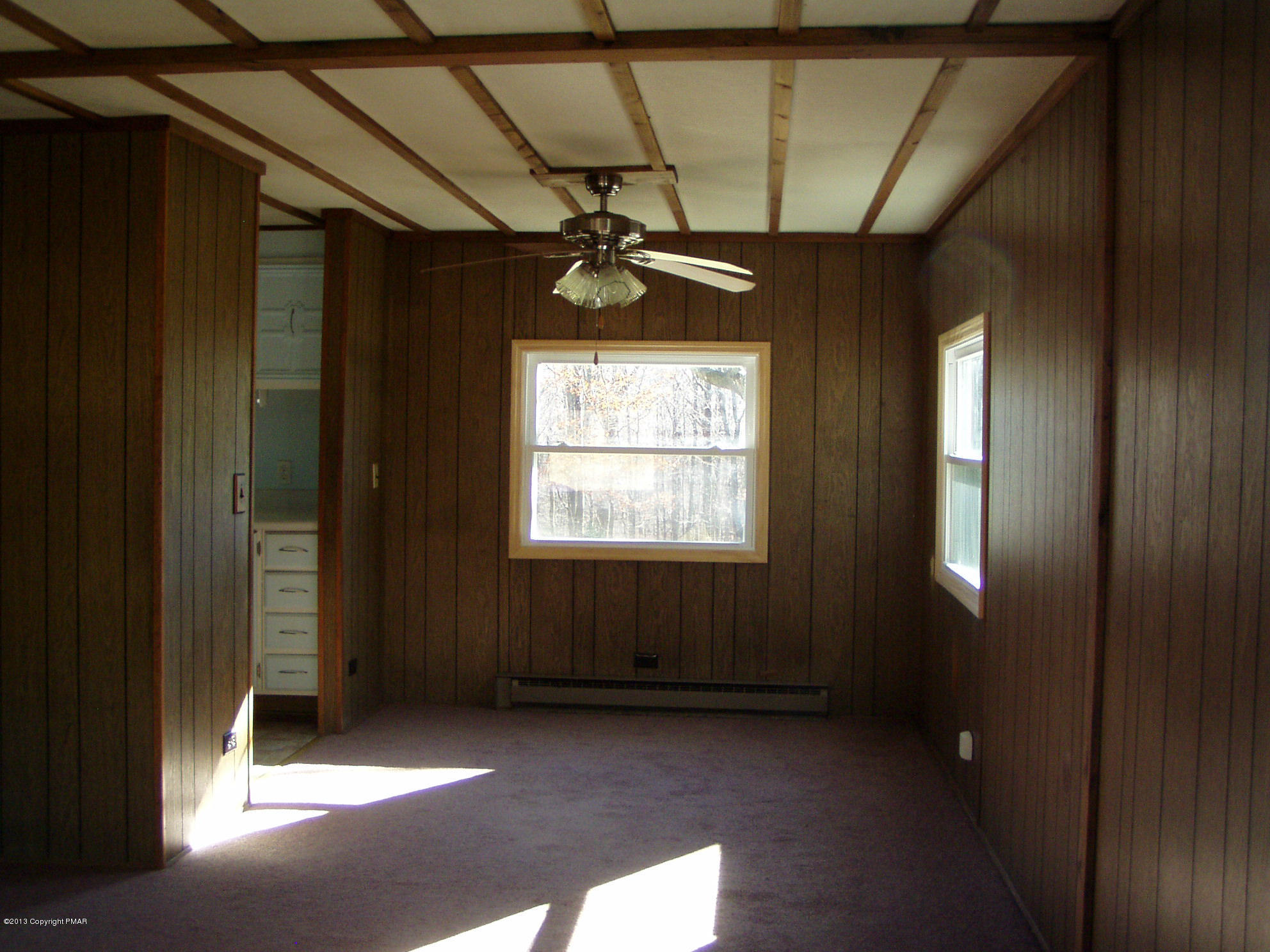 340 Summit Road Swiftwater, PA 18370 - Photo 3 of 16 a view of an empty room with a window
