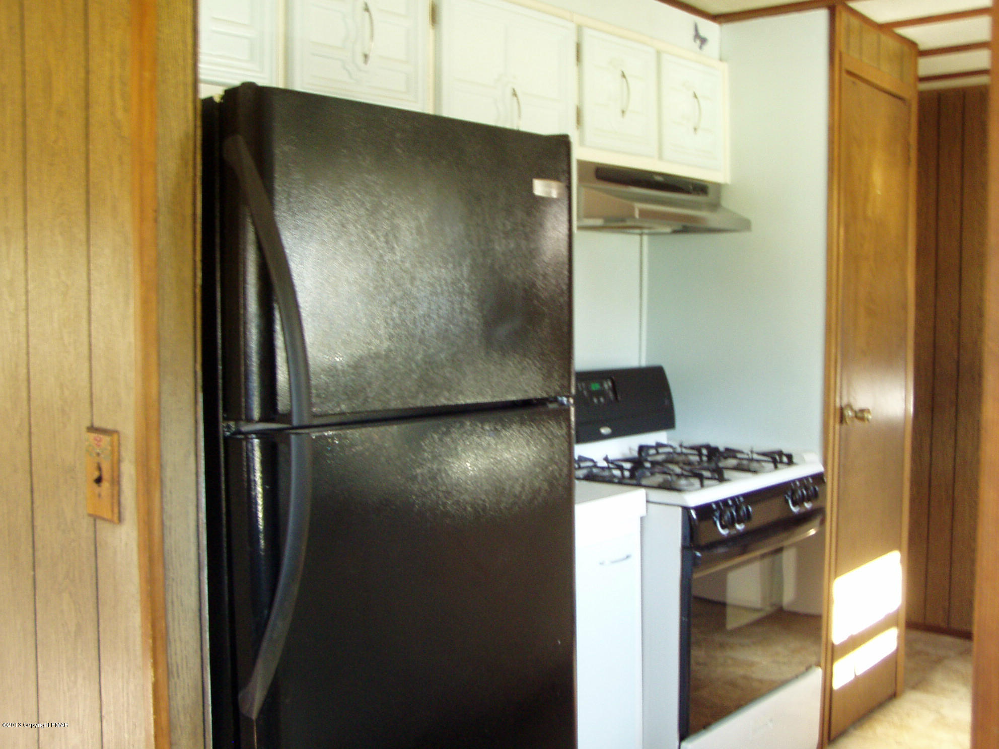 340 Summit Road Swiftwater, PA 18370 - Photo 6 of 16 a metallic refrigerator freezer sitting in a kitchen
