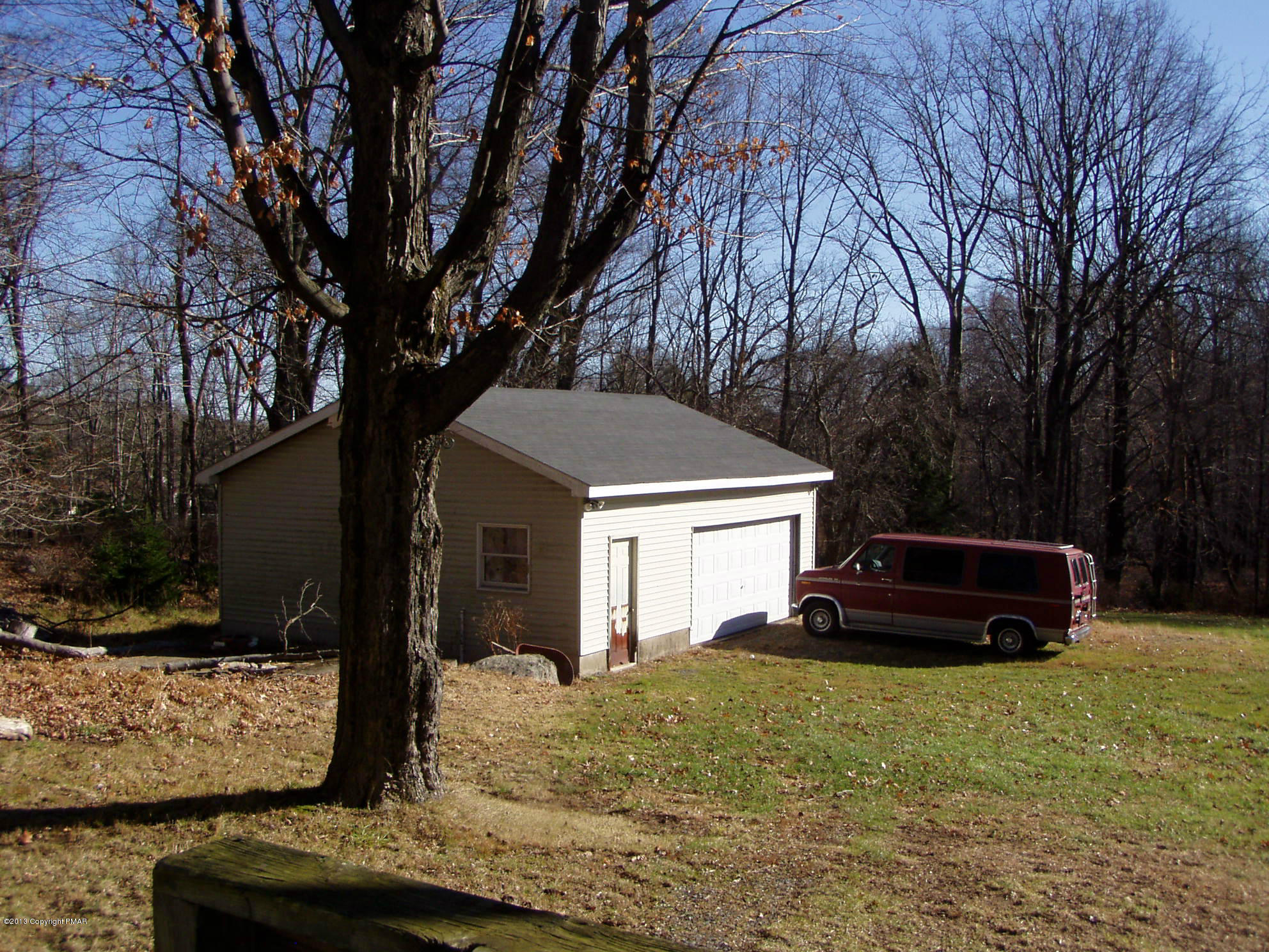 340 Summit Road Swiftwater, PA 18370 - Photo 9 of 16 a view of a house with backyard and trees