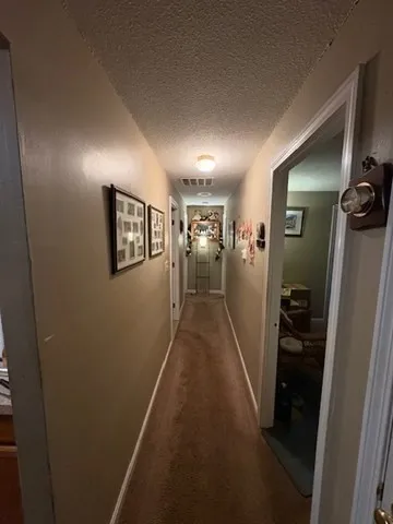 a view of a hallway view with living room