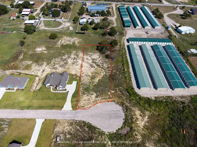 an aerial view of a house with a lake view