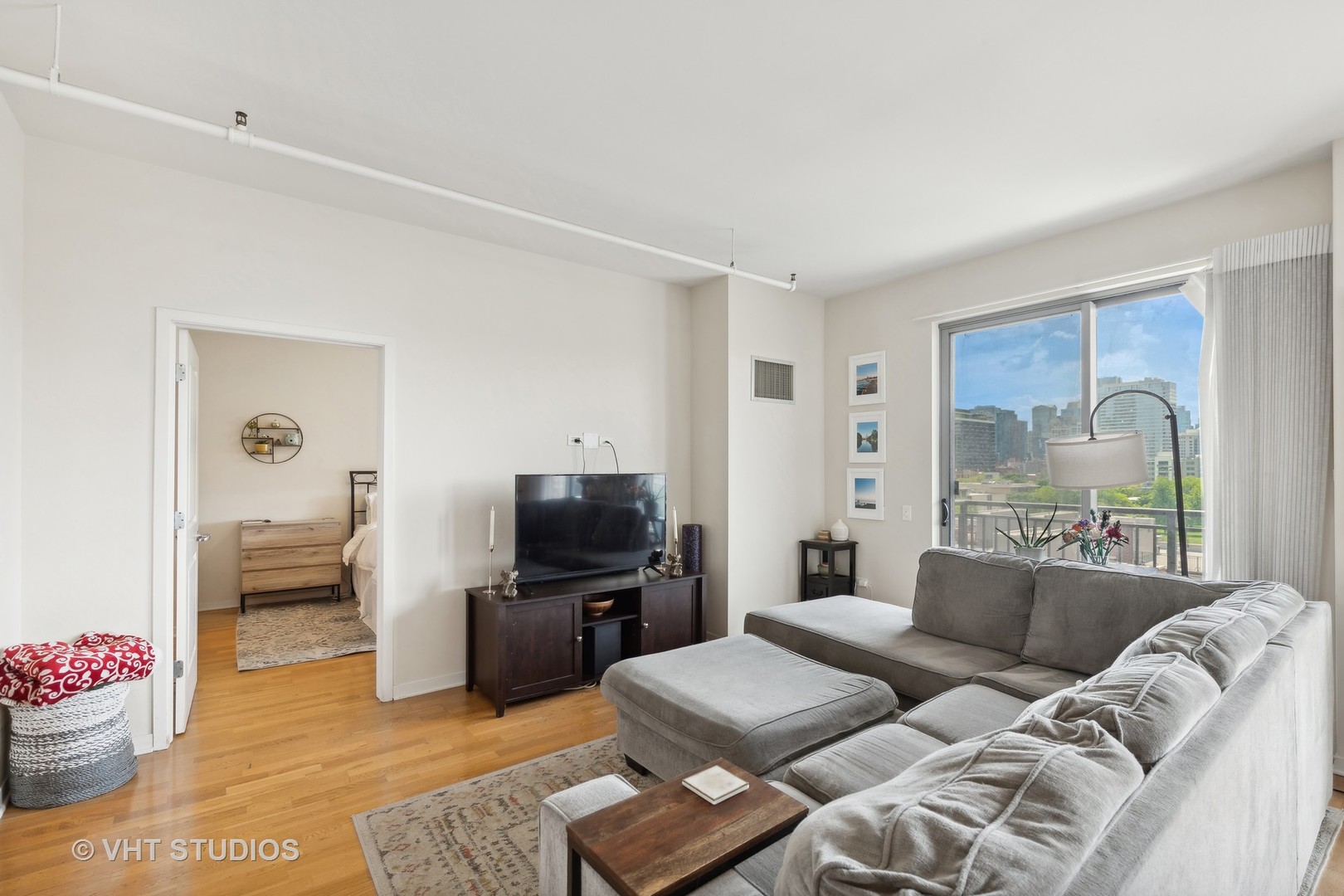 437 West Division Street, Unit 618 Chicago, IL 60610 - Photo 3 of 17 a living room with furniture and a flat screen tv
