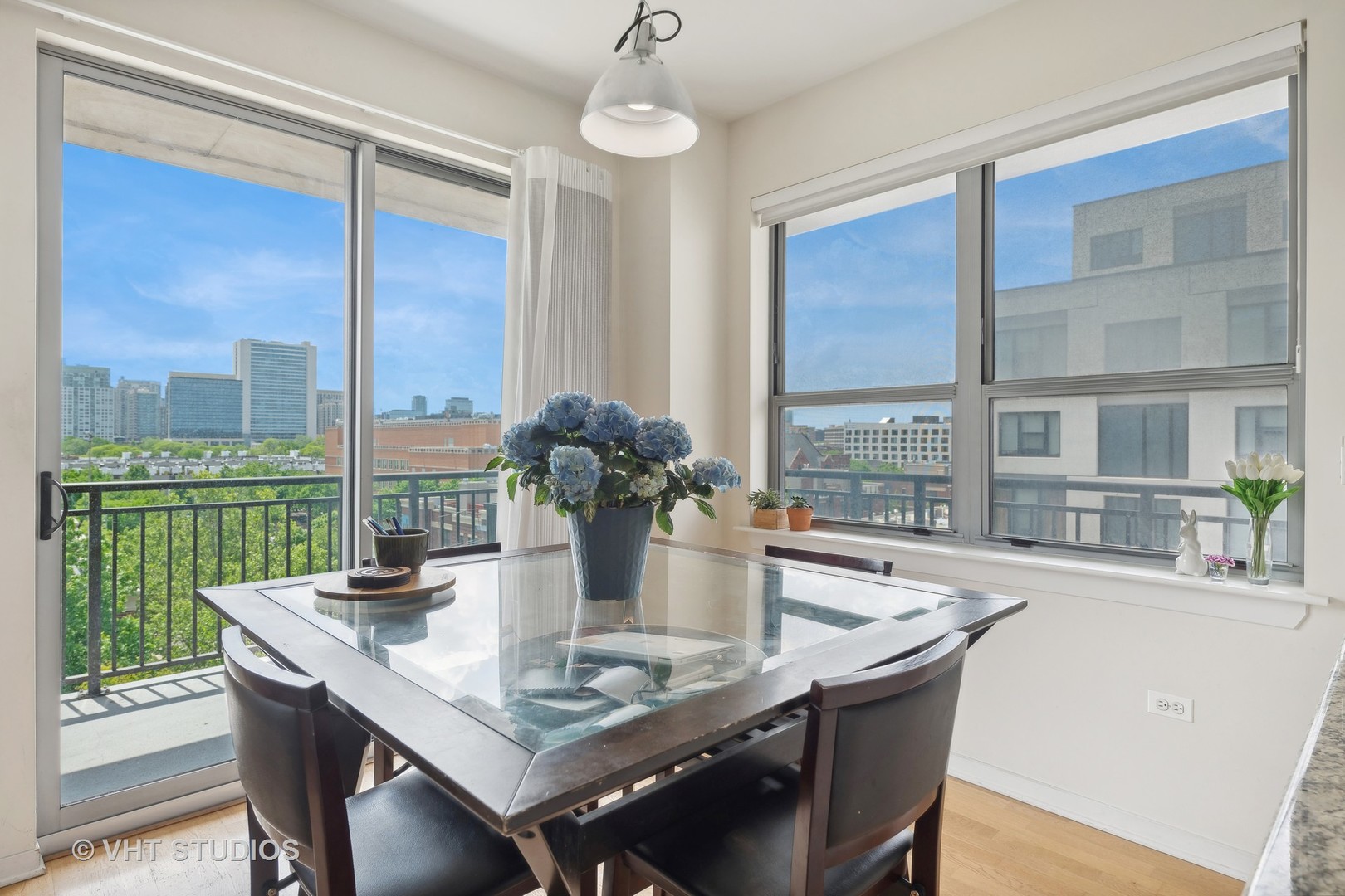437 West Division Street, Unit 618 Chicago, IL 60610 - Photo 5 of 17 a view of a dining table and chairs