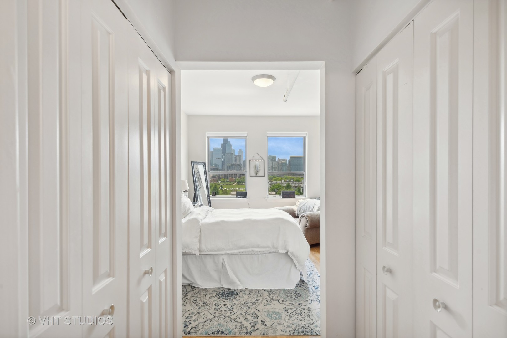 437 West Division Street, Unit 618 Chicago, IL 60610 - Photo 8 of 17 a bed sitting in a bedroom next to a window