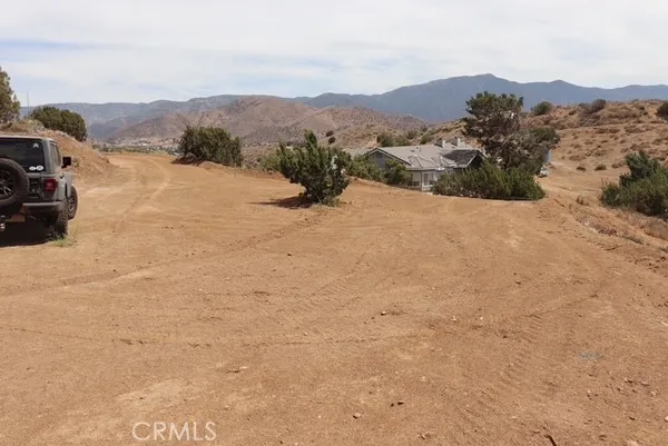 a view of a town with mountains in the background