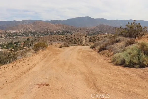 a view of an outdoor space and mountains