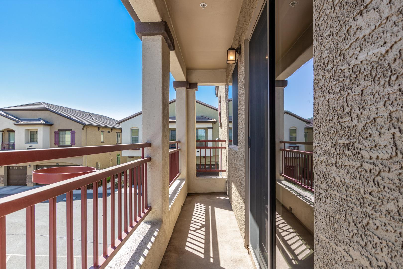 2725 East Mine Creek Road, Unit 2172 Phoenix, AZ 85024 - Photo 24 of 28 a view of a balcony with wooden floor and fence