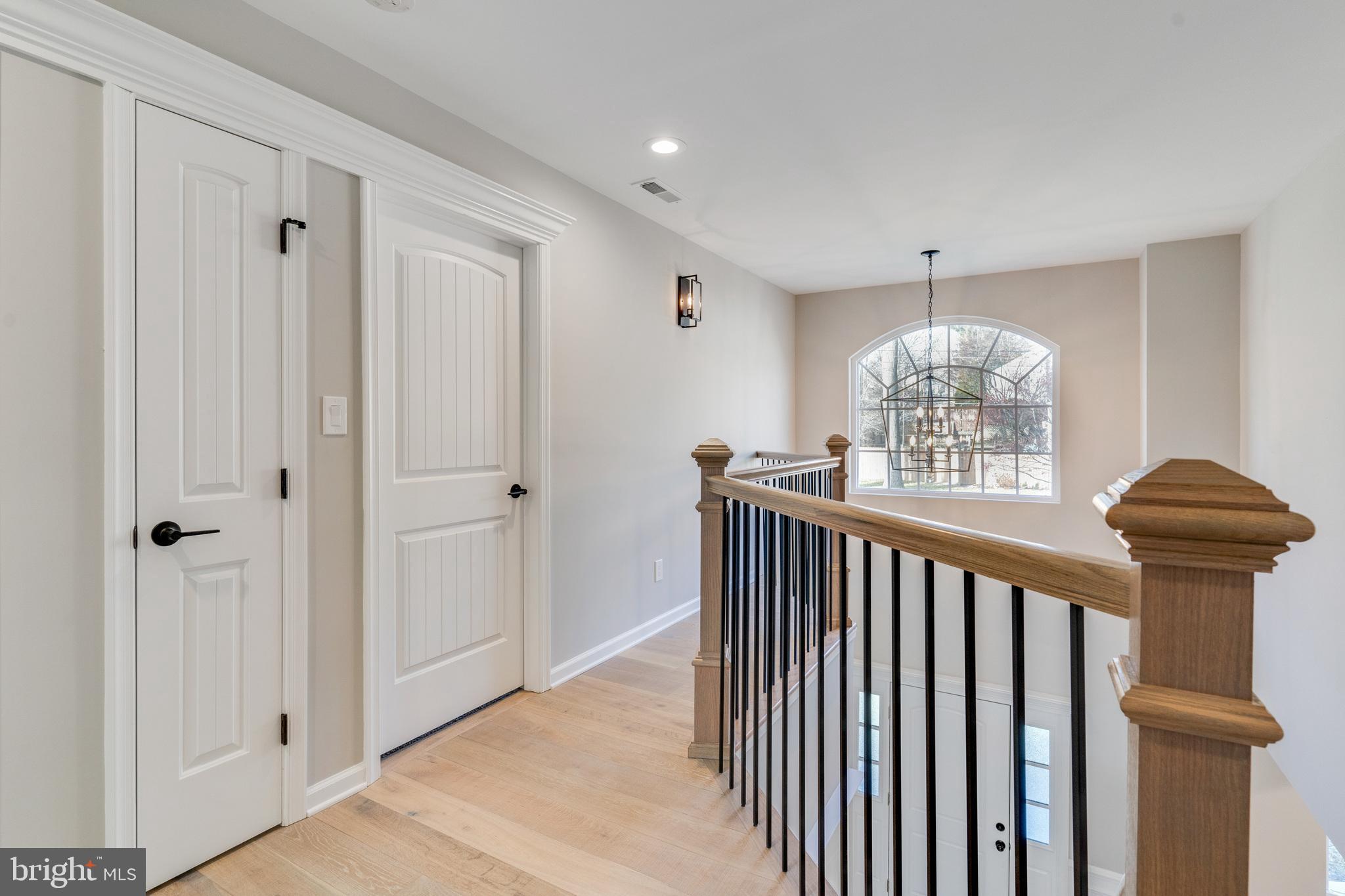 1021 West Maple Avenue Langhorne, PA 19047 - Photo 13 of 37 a view of entryway with wooden floor and chandelier