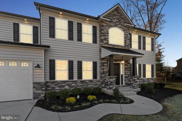 a view of a house with potted plants