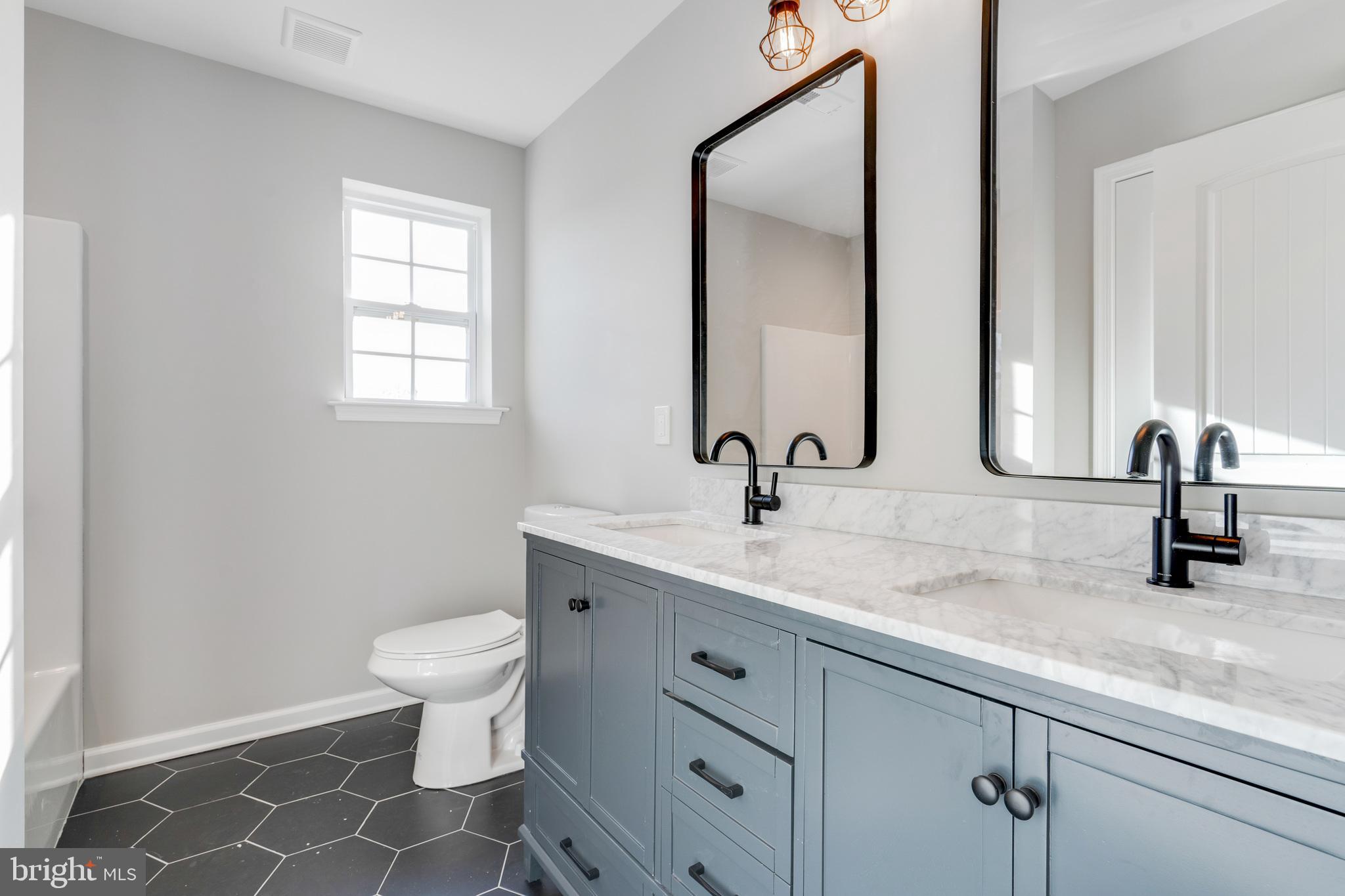 1021 West Maple Avenue Langhorne, PA 19047 - Photo 23 of 37 a bathroom with a sink and a toilet