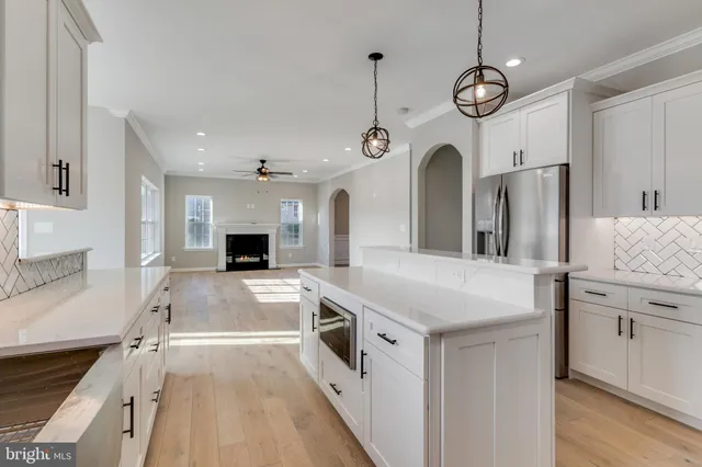 a kitchen with stainless steel appliances granite countertop a stove and a sink