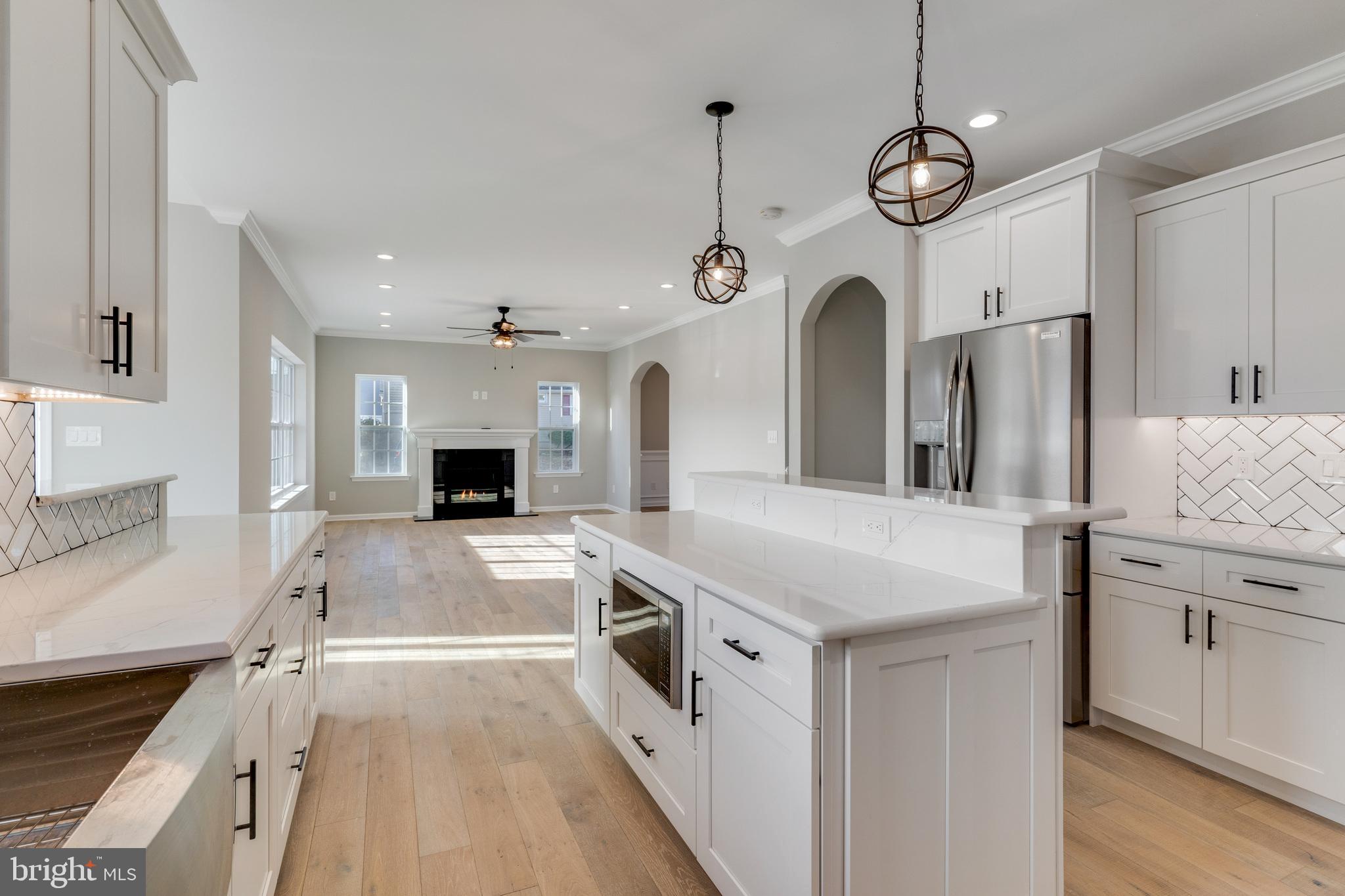 1021 West Maple Avenue Langhorne, PA 19047 - Photo 3 of 37 a kitchen with stainless steel appliances granite countertop a stove and a sink