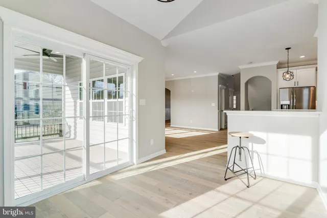 a view of a kitchen with a sink and cabinets