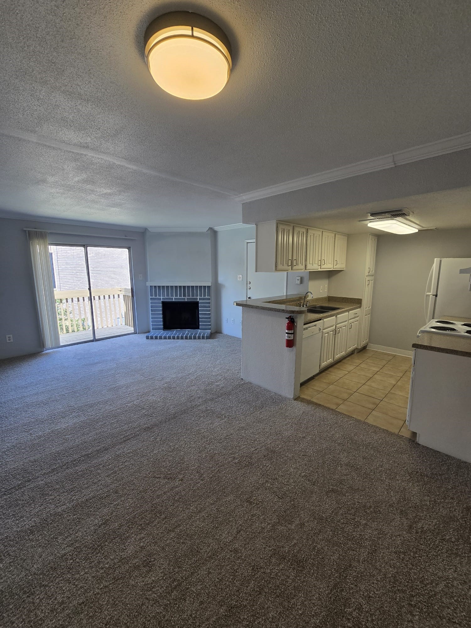 4747 Allendale Road, Unit 50 Houston, TX 77017 - Photo 8 of 9 a view of a kitchen with a sink cabinets and a fireplace