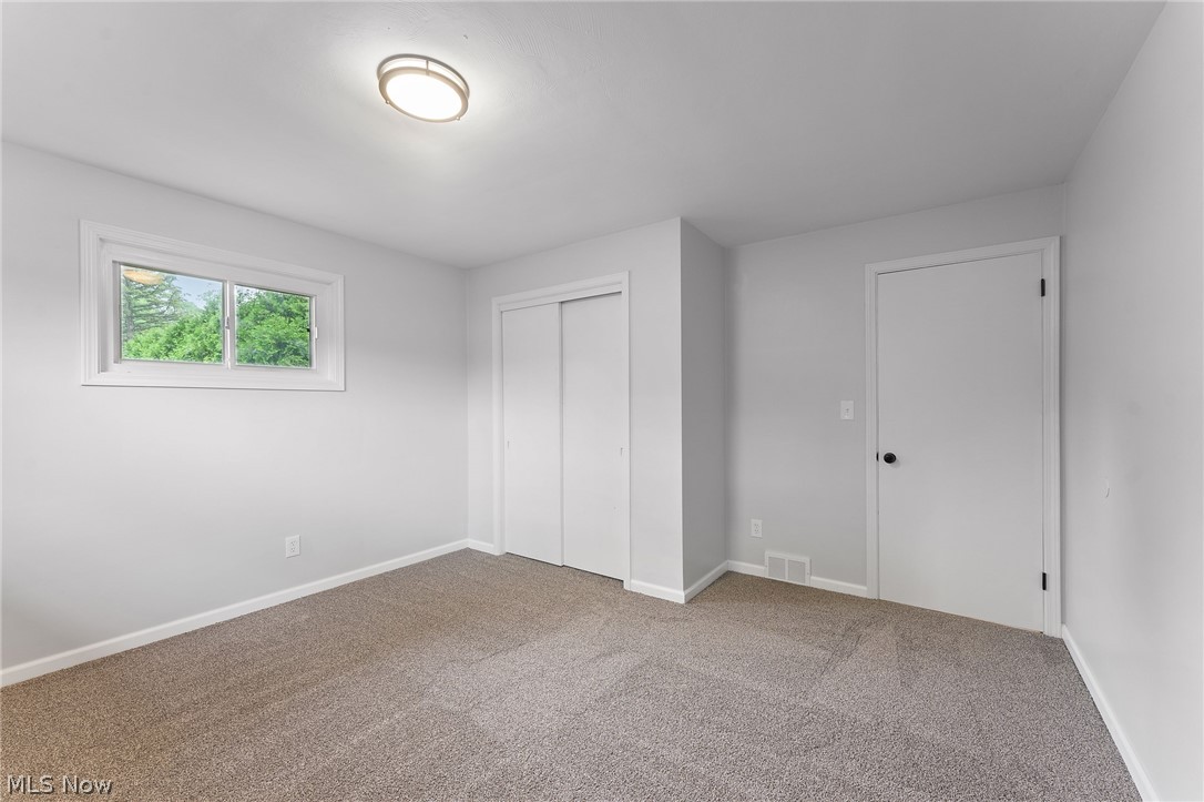 962 Keefer Road Girard, OH 44420 - Photo 18 of 31 Unfurnished bedroom with a closet and carpet