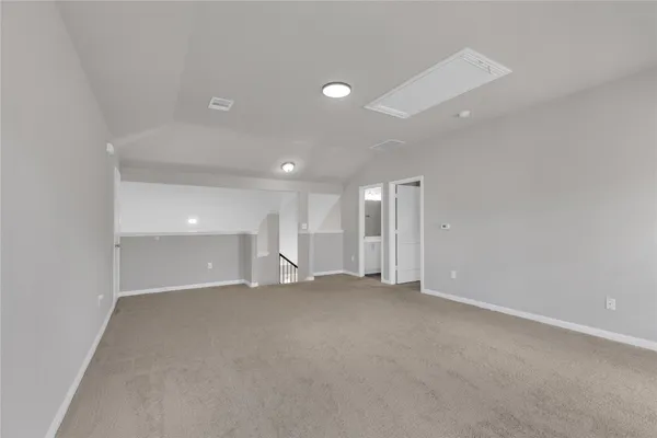 an empty room with windows and pillars in it