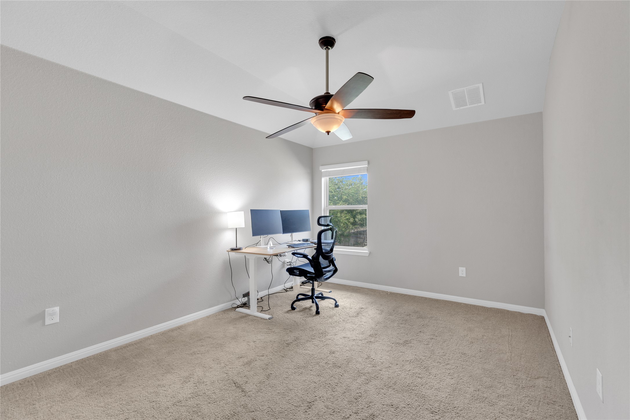 721 Schefer Street Leander, TX 78641 - Photo 31 of 38 a workspace with furniture and a ceiling fan