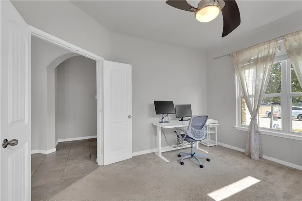 a work room with furniture and a window