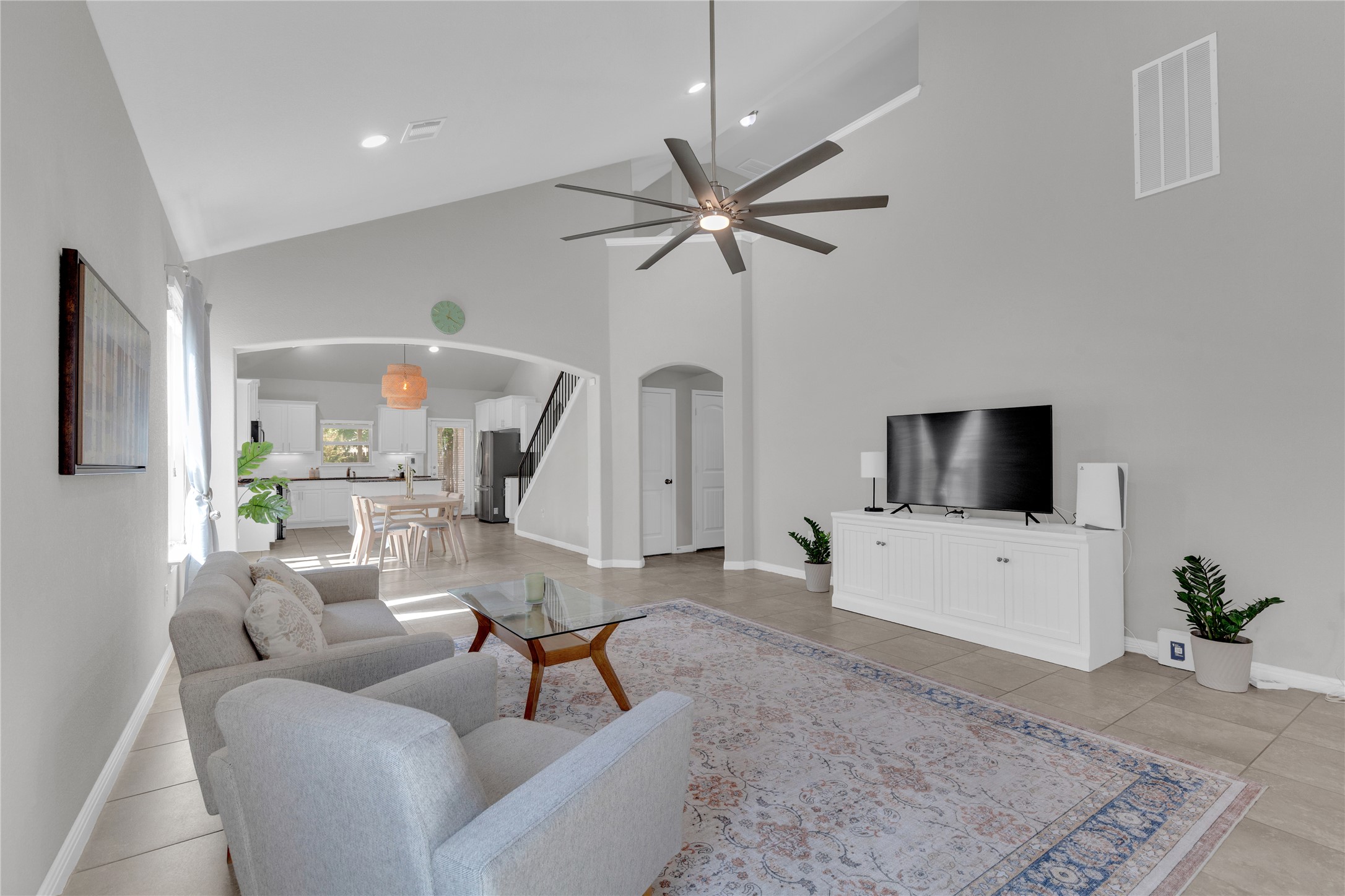 721 Schefer Street Leander, TX 78641 - Photo 5 of 38 a living room with furniture and a flat screen tv