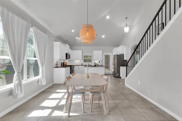 a view of kitchen with cabinets and wooden floor