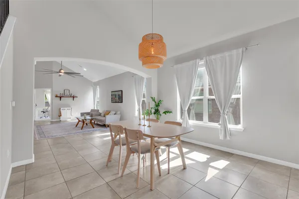 a view of a dining room with furniture and windows