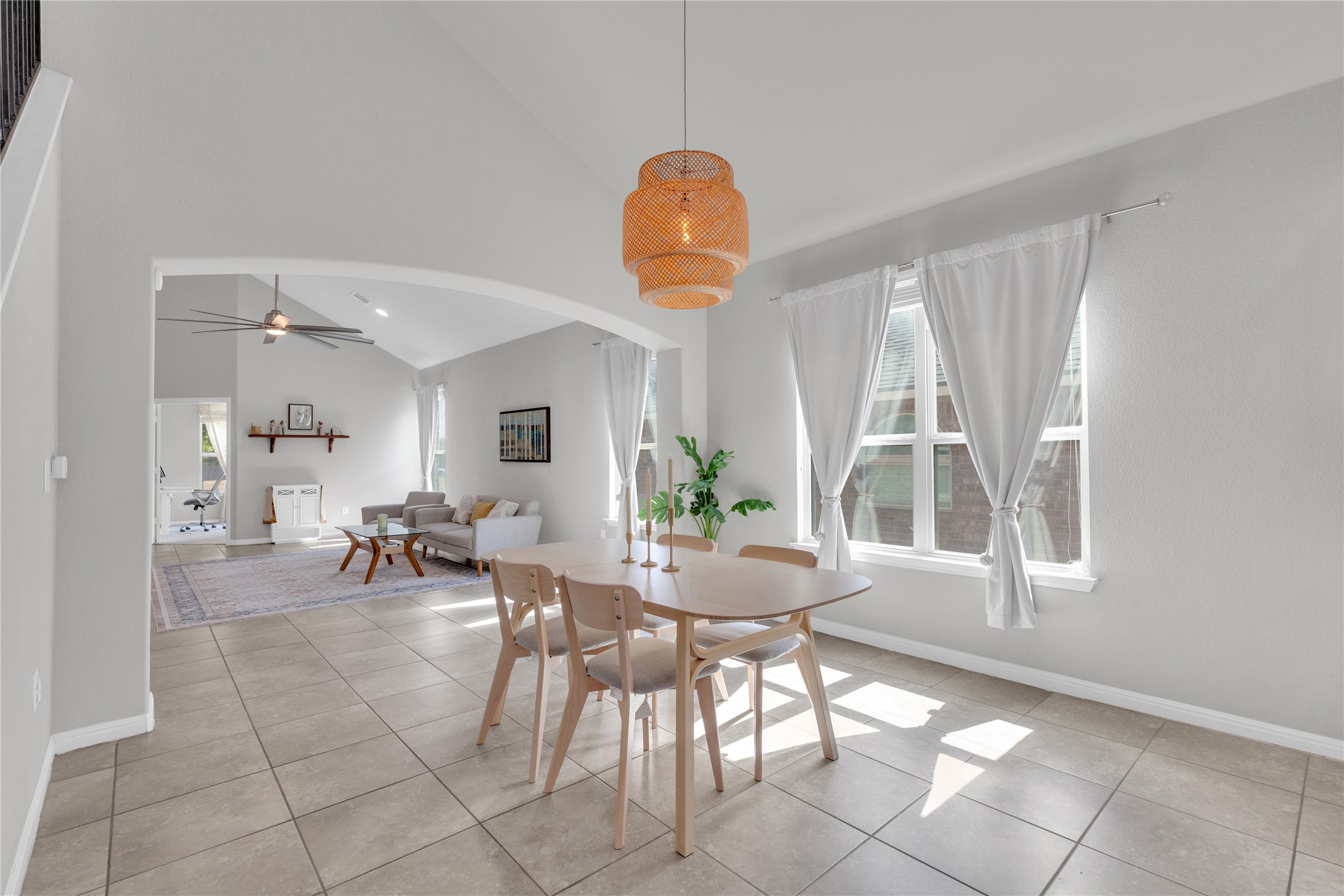 721 Schefer Street Leander, TX 78641 - Photo 9 of 38 a view of a dining room with furniture and windows