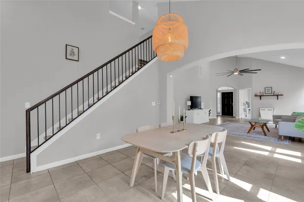 a view of a dining room and hall with wooden floor