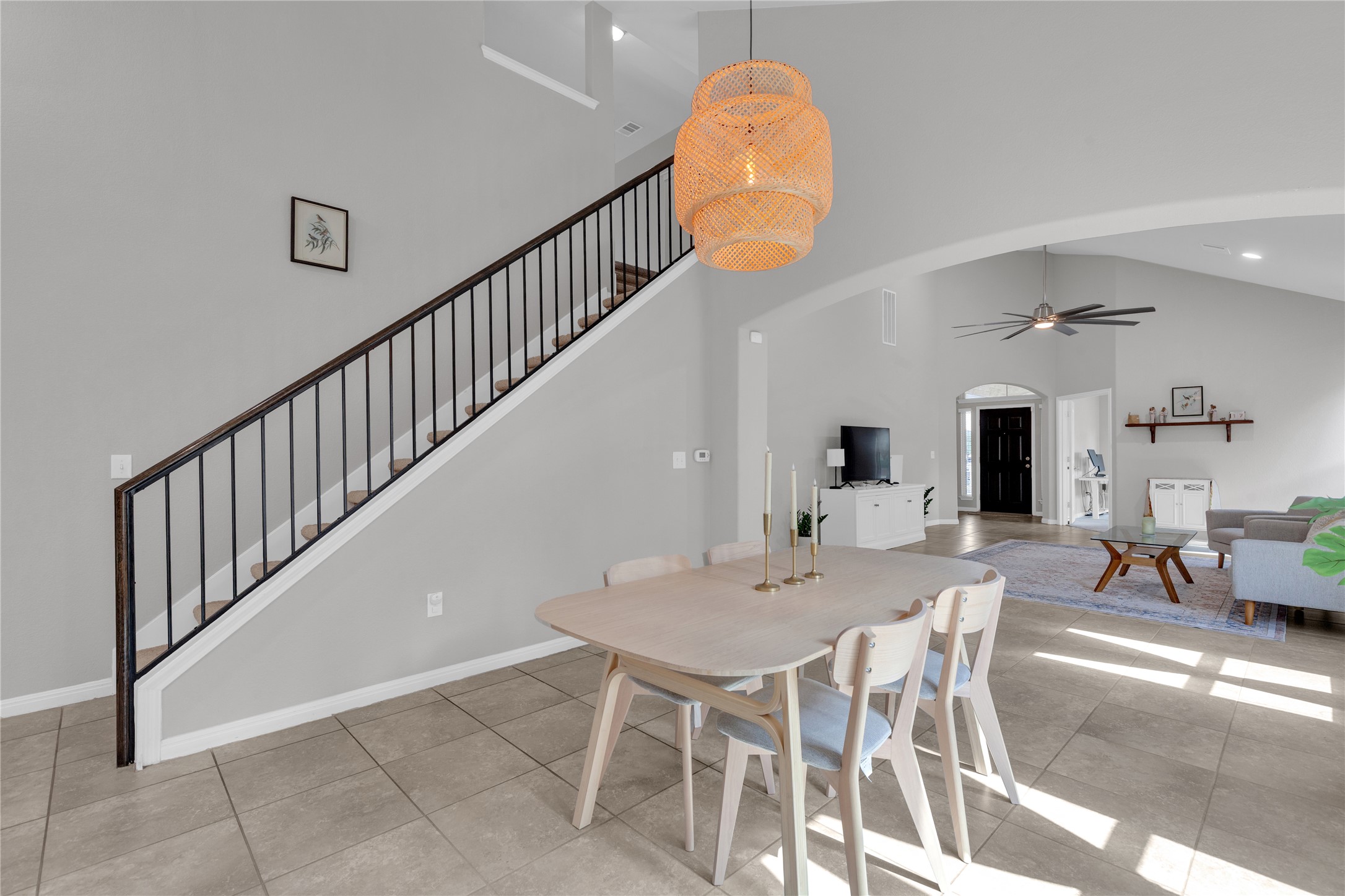 721 Schefer Street Leander, TX 78641 - Photo 10 of 38 a view of a dining room and hall with wooden floor
