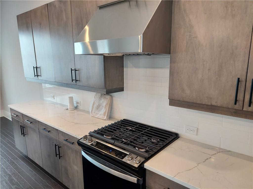 314 Fair Street Southwest Atlanta, GA 30313 - Photo 12 of 22 a kitchen with a stove and a sink