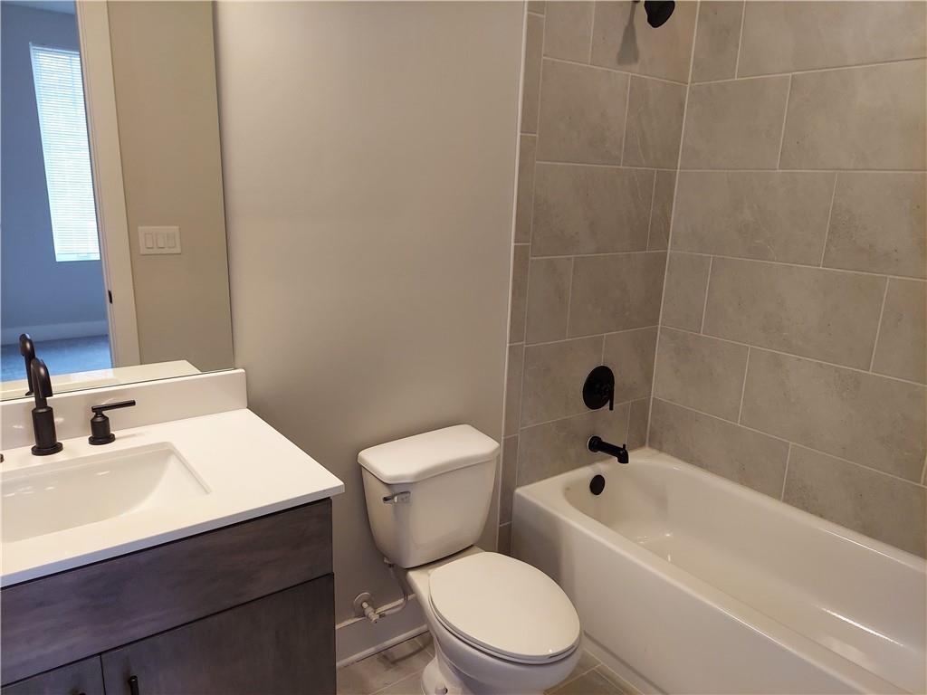 314 Fair Street Southwest Atlanta, GA 30313 - Photo 8 of 22 a bathroom with a sink a toilet and shower