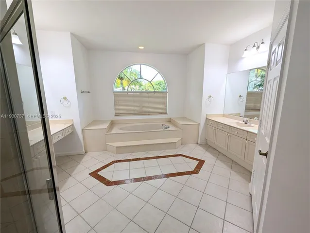 a view of kitchen with sink and wooden floor