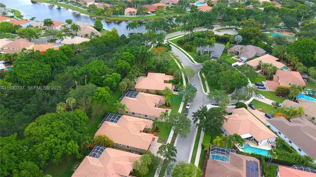 an aerial view of residential house with outdoor space and swimming pool