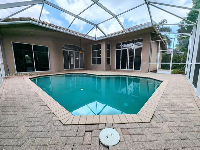 a view of a house with a swimming pool