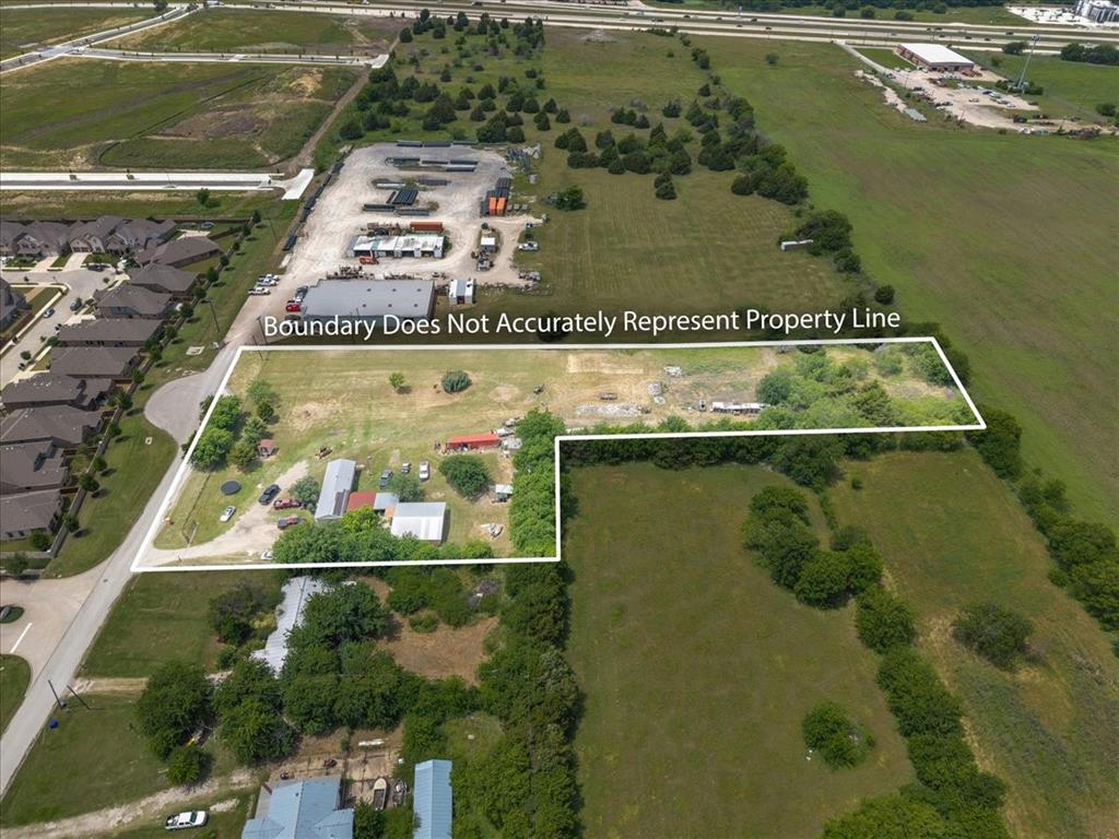 2511 Mathis Road Mansfield, TX 76063 - Photo 12 of 23 Land parcel with direct road frontage, multiple structures, established tree lines, and open grass areas
