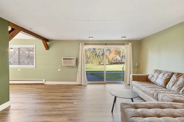 a living room with furniture and window