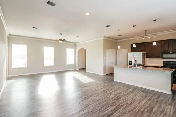 a view of a kitchen and a room with a kitchen
