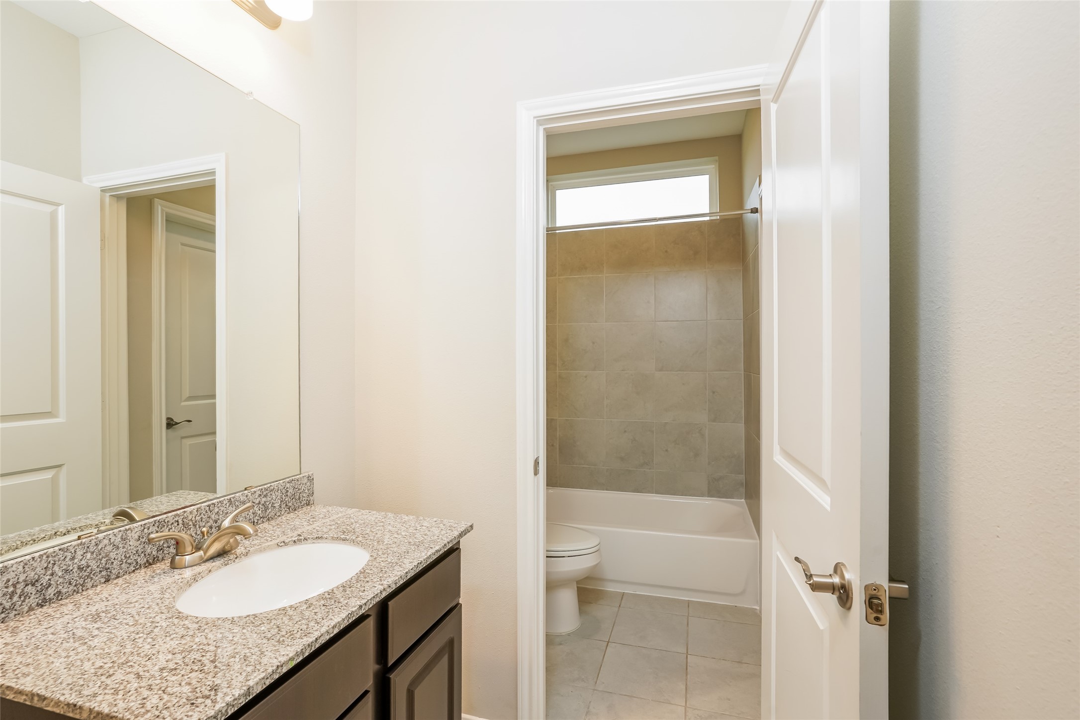 1538 Lakeland Circle Rosharon, TX 77583 - Photo 7 of 12 a bathroom with a granite countertop sink toilet and shower