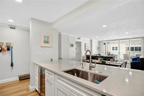 a kitchen with a sink and refrigerator