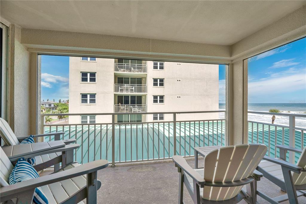 4505 South Atlantic Avenue, Unit 305 Ponce Inlet, FL 32127 - Photo 16 of 34 a view of a chair in the balcony