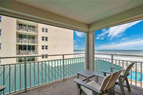 a view of a balcony with chairs