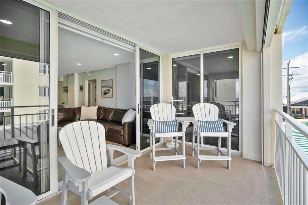 4505 South Atlantic Avenue, Unit 305 Ponce Inlet, FL 32127 - Photo 18 of 34 a view of a dining room with furniture and wooden floor