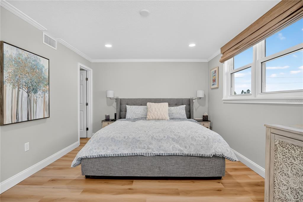 4505 South Atlantic Avenue, Unit 305 Ponce Inlet, FL 32127 - Photo 20 of 34 a bedroom with a bed and window