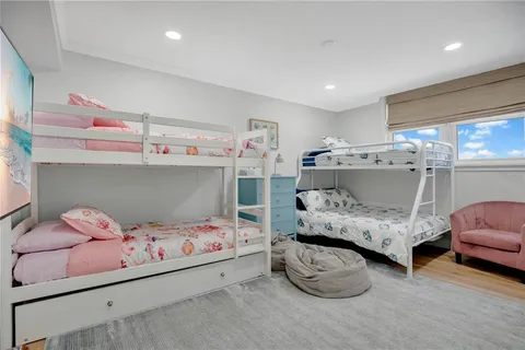 a bedroom with a bed and a tv