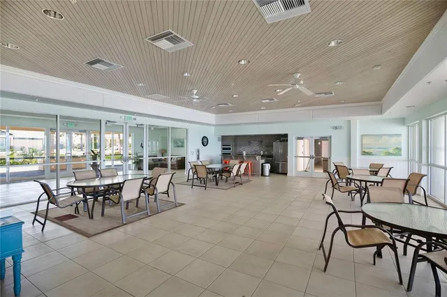 a view of a dining room with furniture and a livingroom